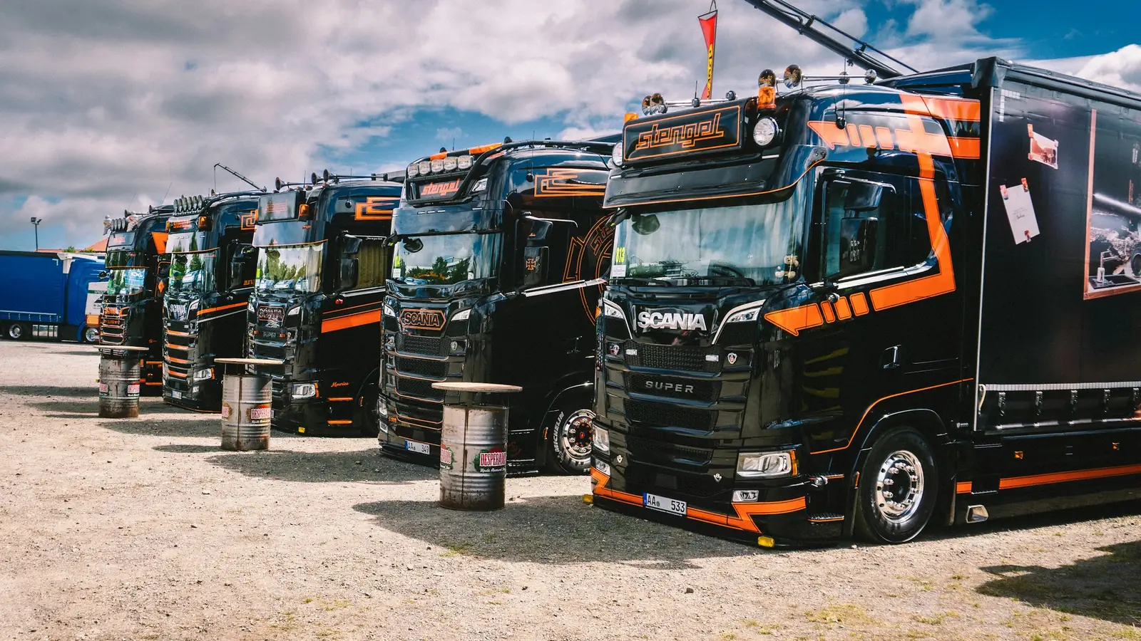 Row of freight trucks parked at a distribution yard, commercial debt collection in Mexico